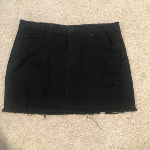 Distressed black jean skirt